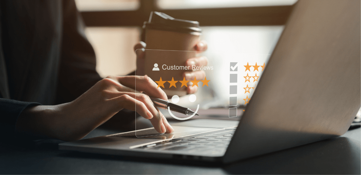Customer leaving positive review on laptop