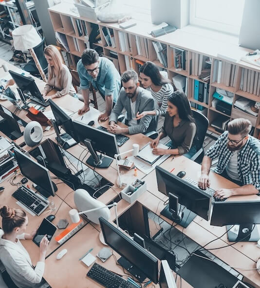 Young programmers working together in a start up office space