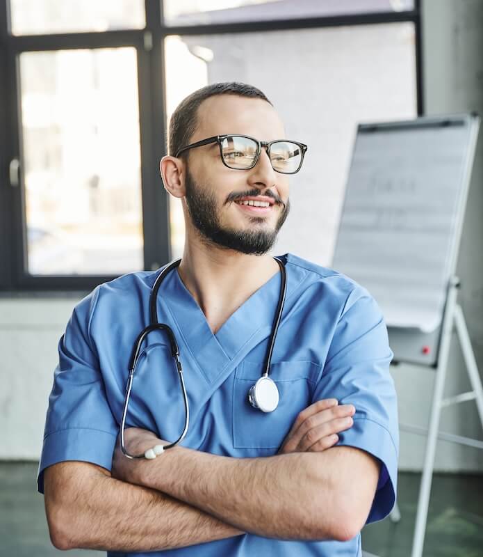 doctor in office with arms crossed