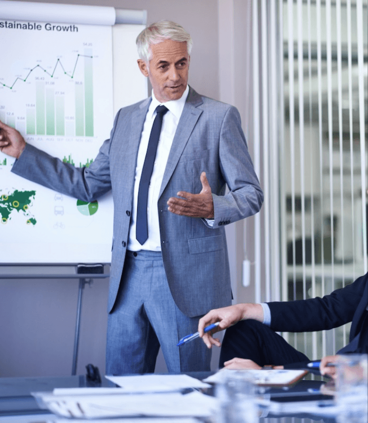 businessman giving a presentation to his colleagues