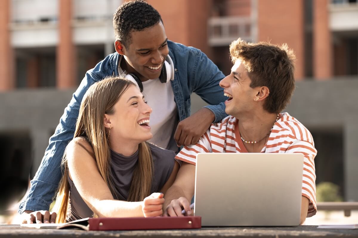 College students reviewing information on a laptop, representing education email marketing campaigns, student recruitment, and enrollment communications.